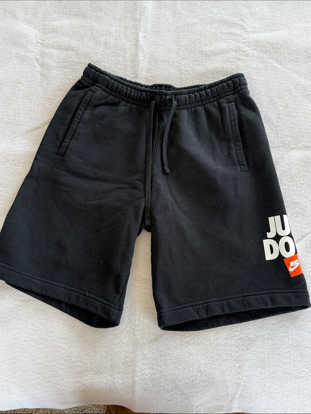 Nike Black Athletic 'Just Do It' Logo Shorts with Orange Accent